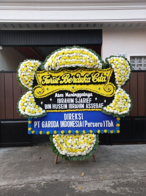 Papan Bunga Duka di Batang Natal